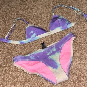 purple and white TRIANGL swimsuit set